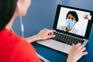 A virtual medical assistant working remotely, managing patient appointments and administrative tasks for a healthcare practice