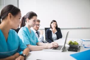 clinical medical assistant vs medical assistant doctors looking at the laptop