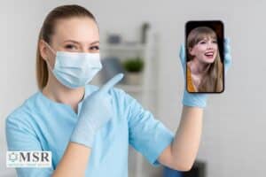 taylor swift amas dental care dentist holding the cellphone