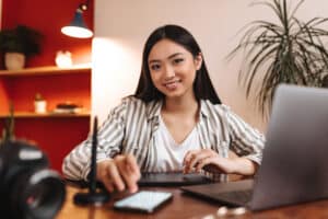 virtual assistant skills woman with gadget above her table