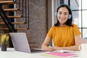 what is a virtual assistant woman in front of laptop wearing headphone