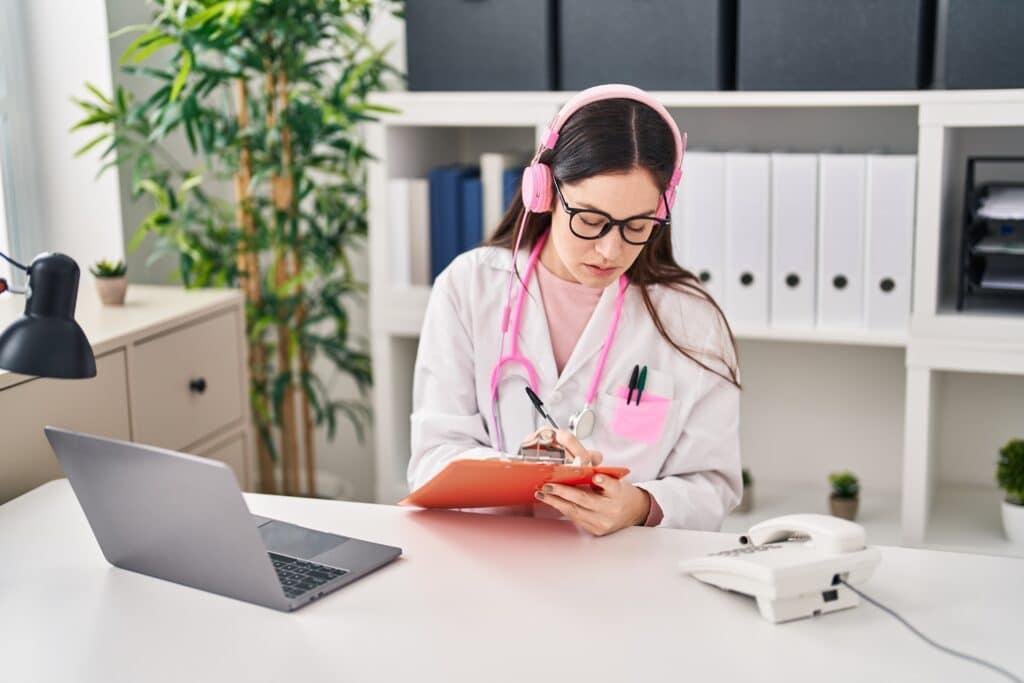 What Does a Virtual Medical Scribe Do woman doctor writing