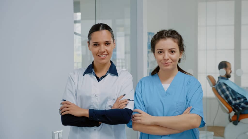 difference between cna and medical assistant two woman