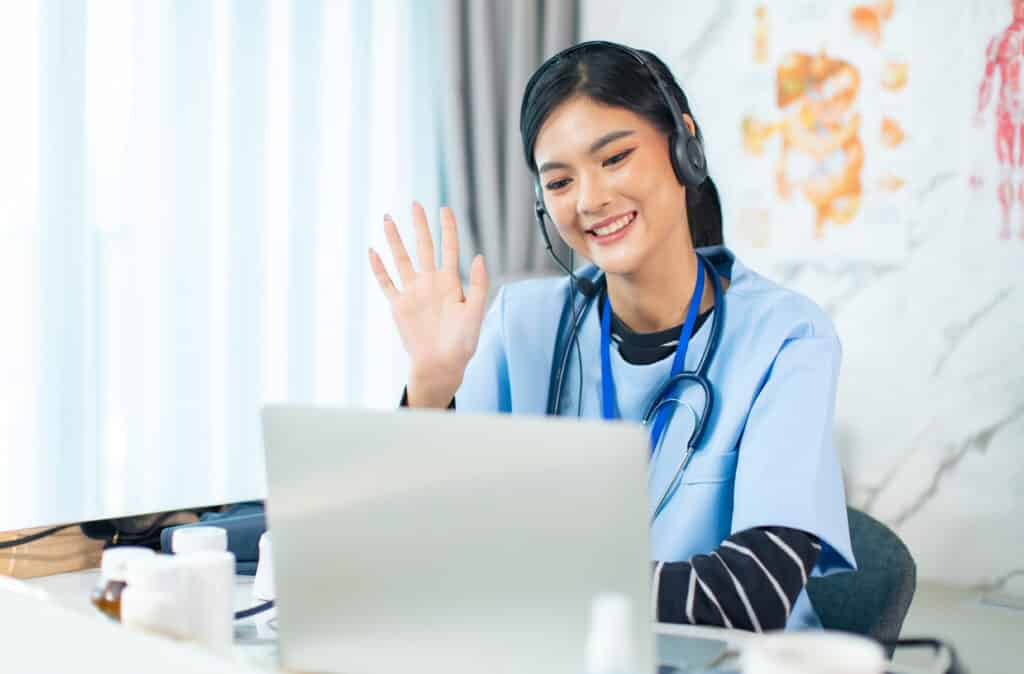 the rise of virtual assistant nurses young woman using laptop table