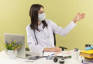 what does a virtual medical scribe do woman doctor raising her left hand