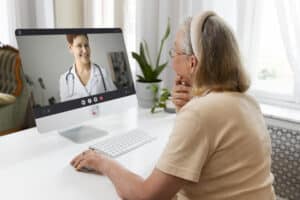 what is a virtual medical scribe old woman talking with doctor virtually