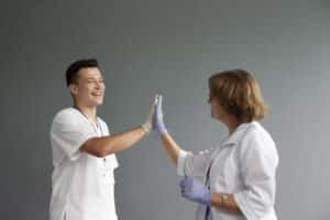 what is a virtual medical scribe two doctors having high five