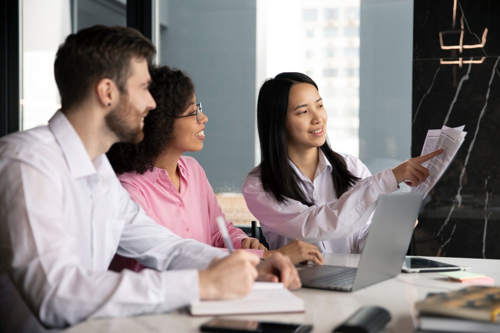 digital marketing for medical practices Three professionals collaborating in a modern office