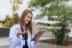 digital marketing for medical practices woman doctor holding tablet