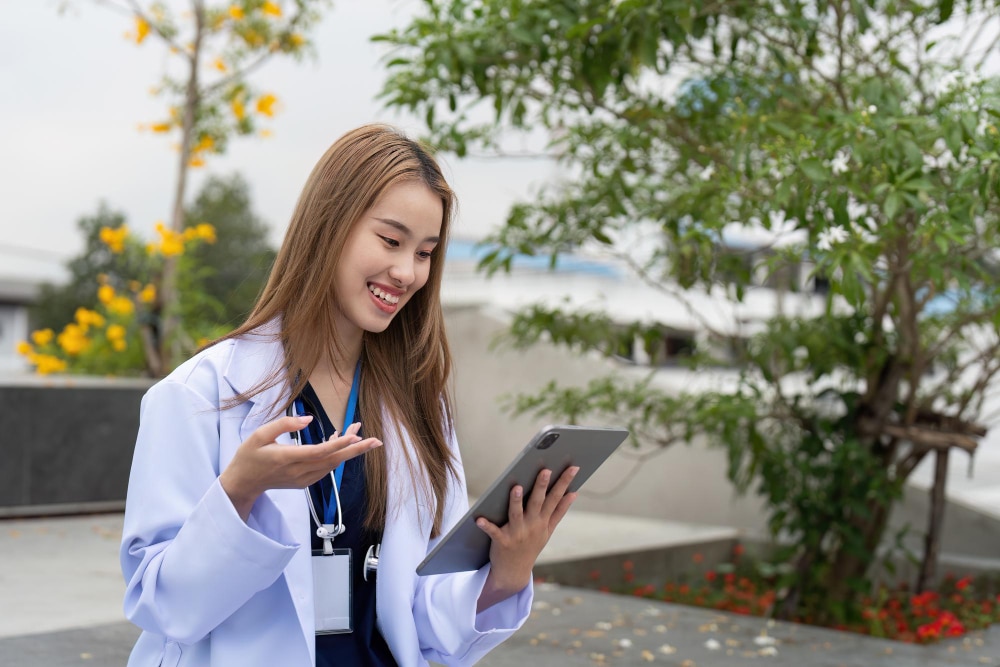 digital marketing for medical practices woman doctor holding tablet