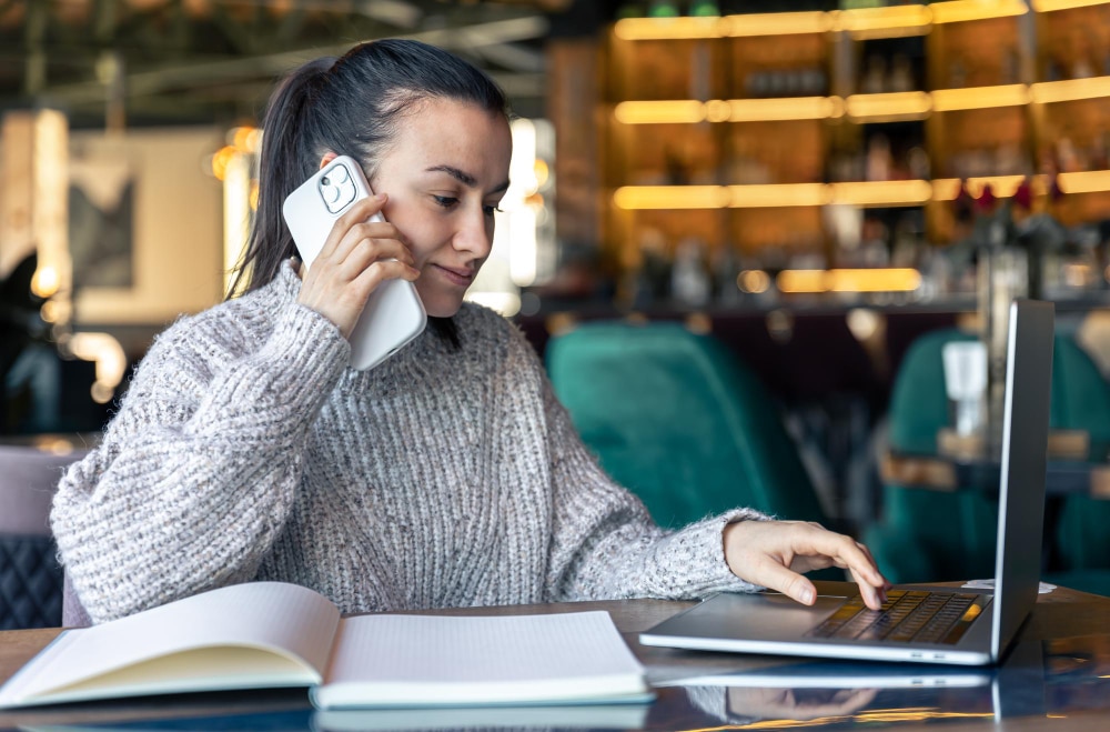 real estate cold callers and appointment setters woman using laptop and having a call