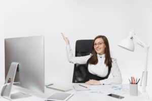 Professional businesswoman working at modern office desk with computer