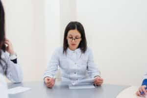 appointment setter position Medical staff in discussion, reviewing patient documents