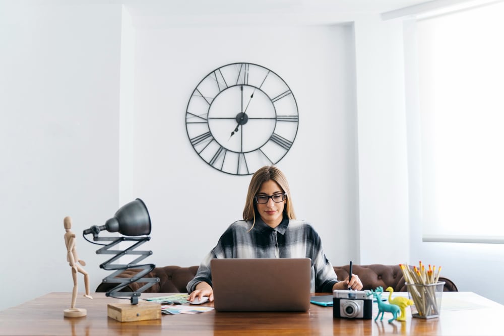 appointment setter position woman working remotely at a stylish desk