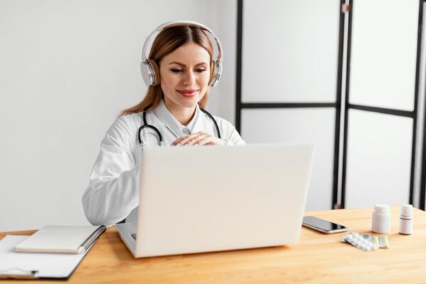 best remote medical scribe companies Female doctor with stethoscope wearing headphone