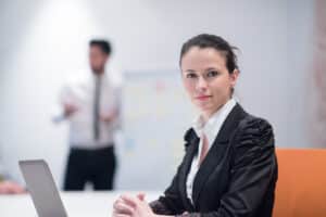 how to become a prior authorization specialist Confident businesswoman in formal attire sitting