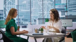 how to become a prior authorization specialist Two professional women having a business meeting