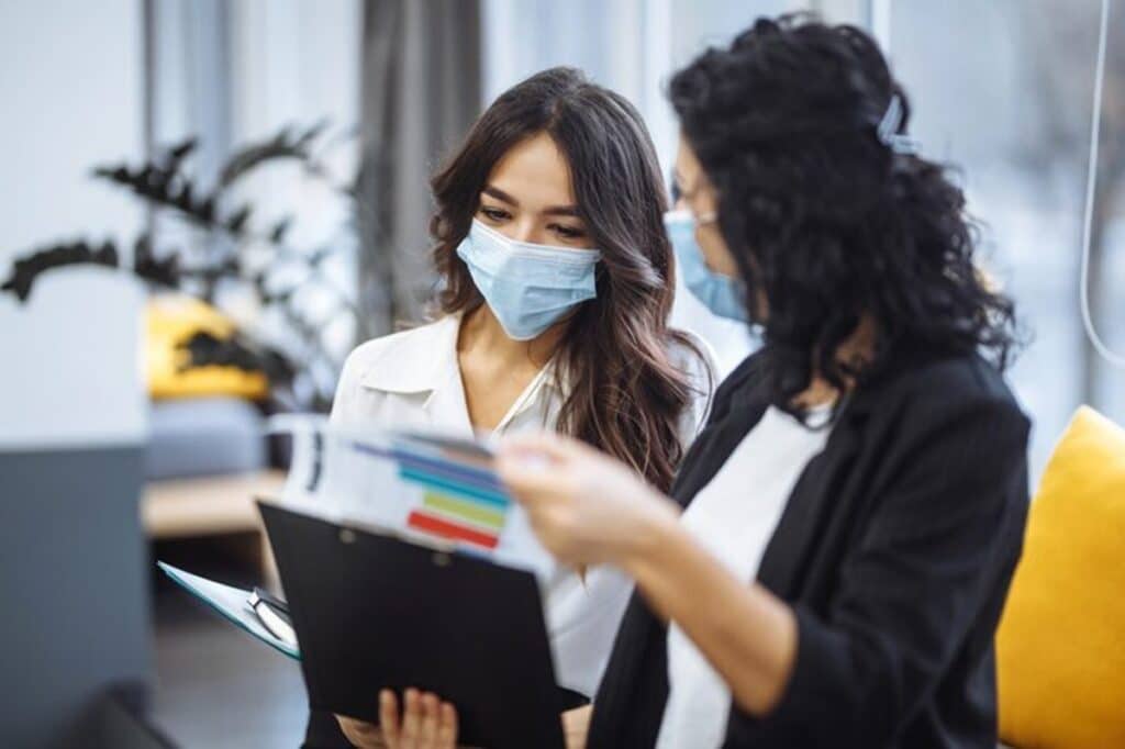 patient care coordinator duties two women talking