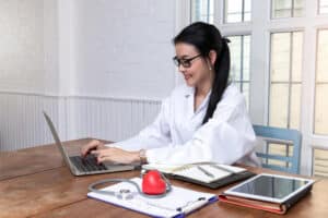 virtual medical billing solutions a female healthcare professional is smiling