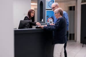 receptionist jobs near me Medical receptionist assisting elderly patients at clinic