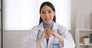 virtual medical assistant for startups Female doctor smiling and speaking in a medical office
