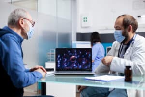 A doctor reviews a patient’s case using visuals, as noted in the Speech Therapy Billing and Coding Guide