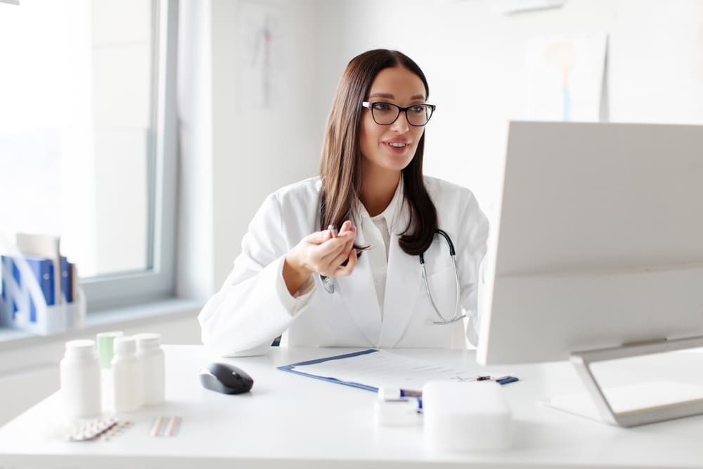 receptionist for medical office Experienced,Woman,Doctor,Working,Remotely,Online,Consulting,Patients,Via,Computer,