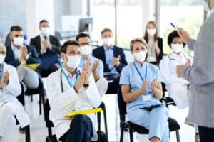 Medical Scribe Training Programs seminar attended by healthcare professionals in masks