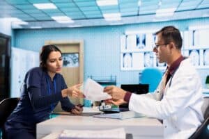 prior authorization workflow support for medical practices doctor chatting with patient