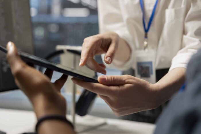 virtual assistant showing to his colleague the data's