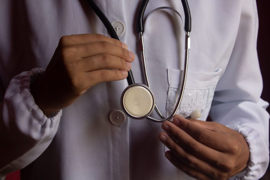 A doctor holding a stethoscope
