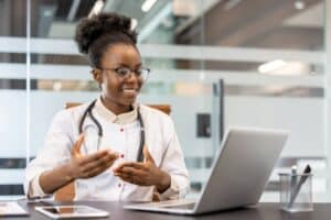 Healthcare professional conducting a virtual consultation as part of a bilingual intake escalation audit.