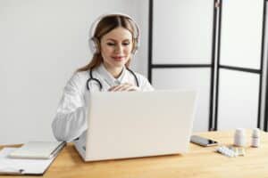 Healthcare professional coordinating virtual referral document follow-up support from a secure digital workspace.