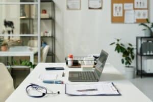 Medical office workspace prepared for the medical referral reactivation call process.