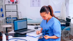 Nurse checking medical referral records for readiness at the clinic.